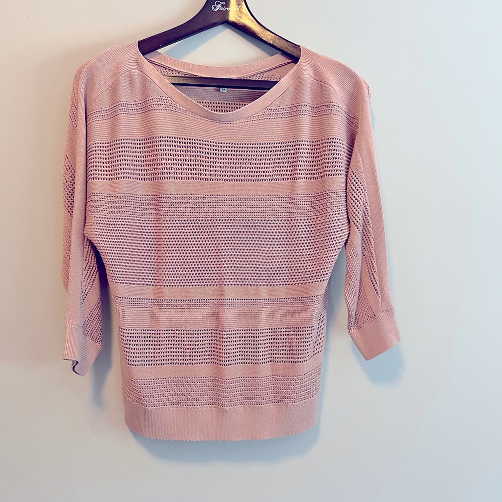 Pink sweater. See through. Cozy but good for the office!